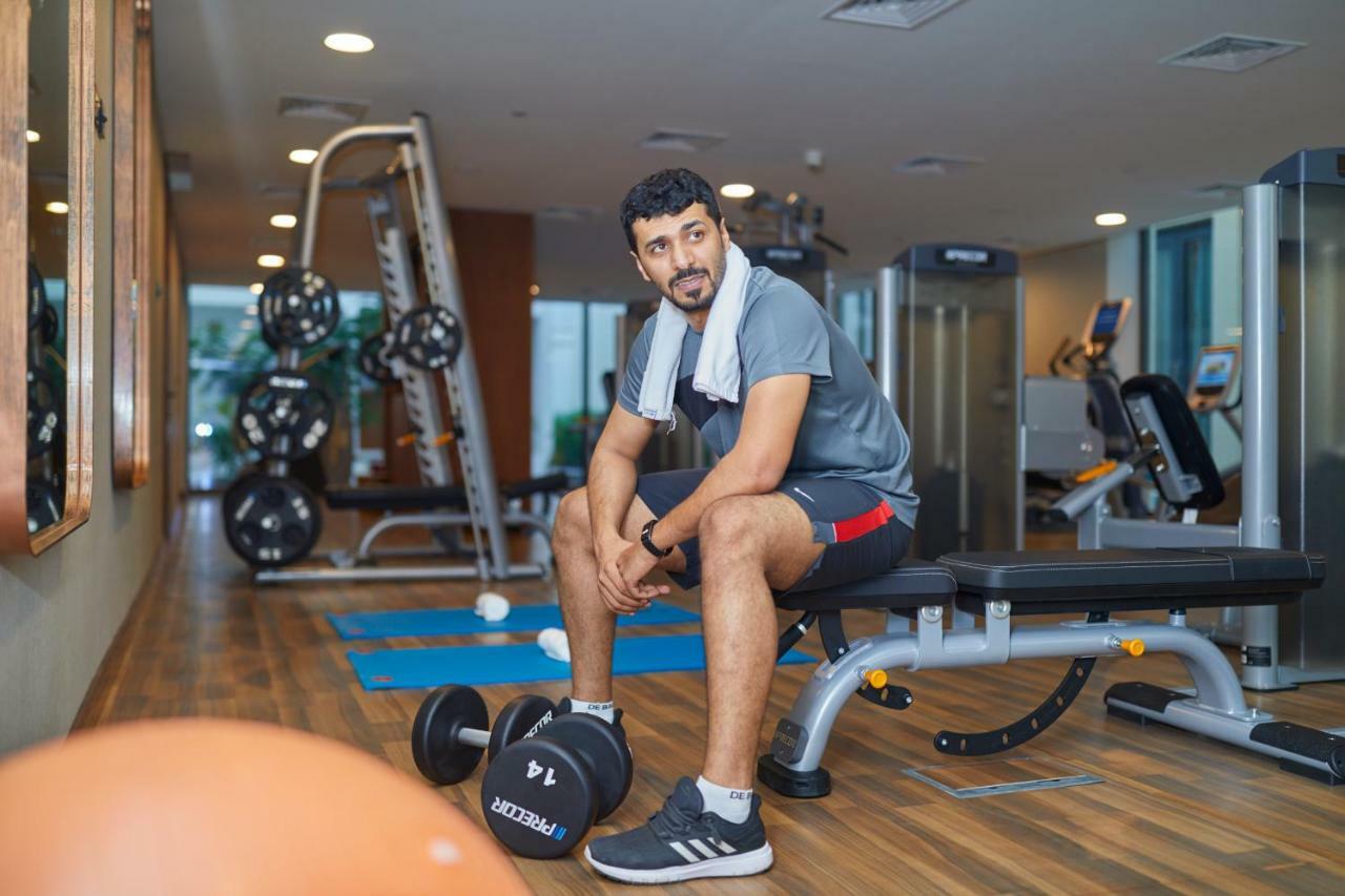 Millennium Resort Salalah Esterno foto A man in a gym